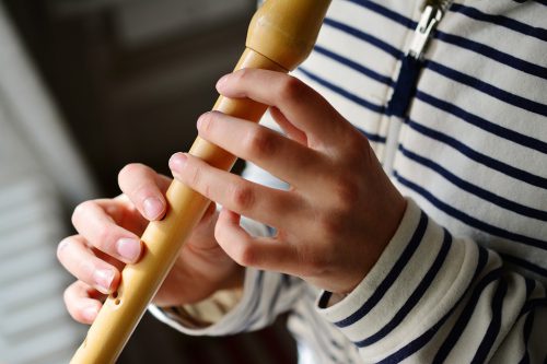 A child plays the recorder